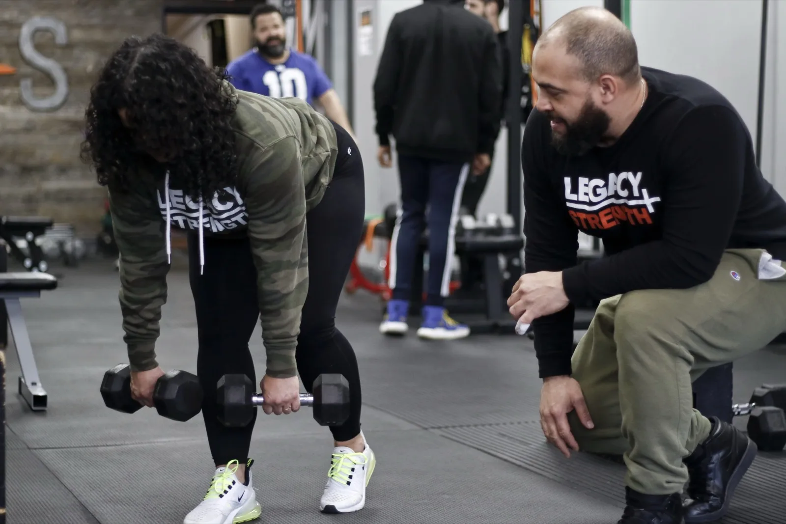 Members training together on the gym floor